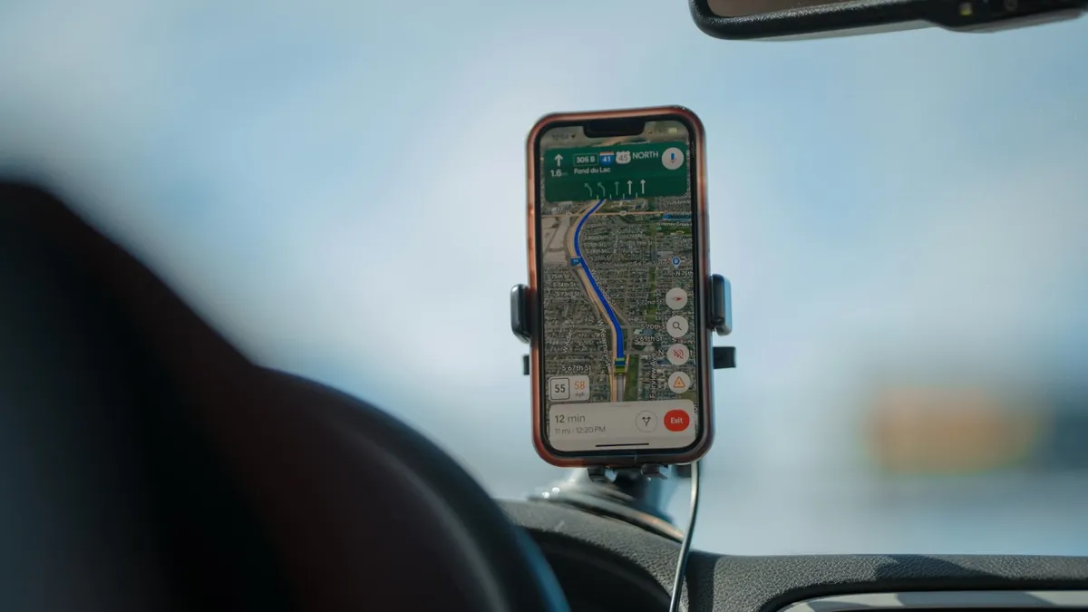 Mobile phone in a cradle showing a navigation map