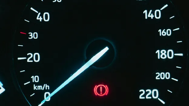 Car speedometer showing speed in km/h
